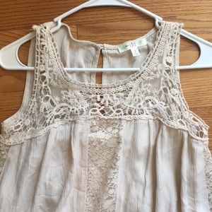 Cream colored lace dress.